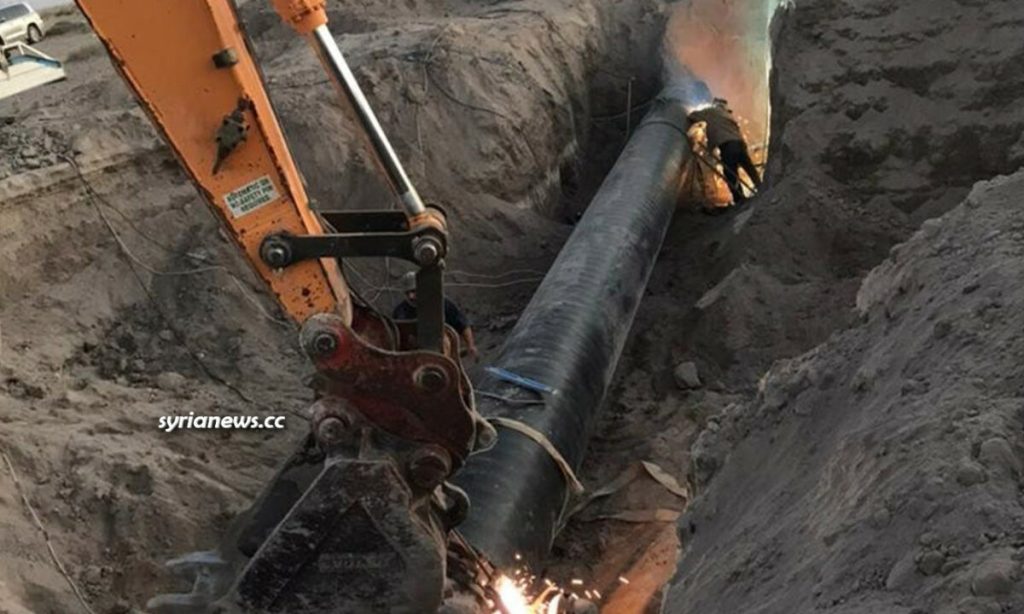 Maintenance teams repairing the Arabian gas pipeline near Deir Ali station blown up by ISIS